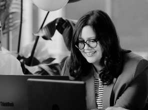 Ingryd reviewing work with her team